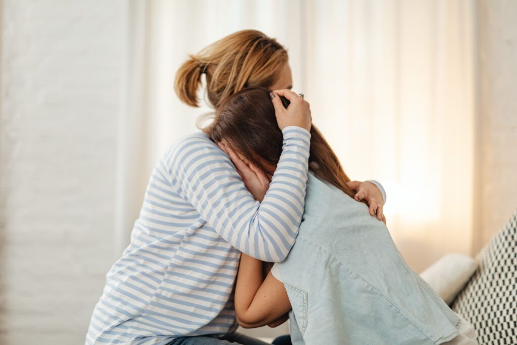 A person comforting a friend